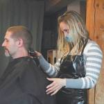 Ashley Story gives a haircut to client Michael Halstead on Friday, April 24, 2020 at her salon Short Cuts on Lake Street in Homer, Alaska. Storys is one of several Homer businesses to reopen their doors Friday according to relaxed state restrictions, while several others have opted to wait. (Photo by Megan Pacer/Homer News)