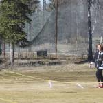 Kay and Kevin Downs approach the green at the first hole at Birch Ridge Golf Course on Saturday, May 2, 2020. Instead of putting the ball in the hole, golfers must hit the yellow noodle instead. (Photo by Jeff Helminiak/Peninsula Clarion)