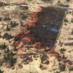 This aerial photo shows how retardant was used to slow the advance of a wildfire toward cabins threatened by the Murray Fire in the Caribou Hills on Sunday, May 10, 2020 near Ninilchik, Alaska. (Photo by Duane Morris/Alaska Division of Forestry)
