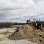 Construction crews are seen here working along the Kenai Spur Highway in Kenai, Alaska, on May 12, 2020. (Photo by Brian Mazurek/Peninsula Clarion)