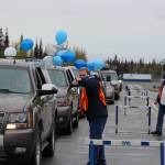 Faculty members of Soldotna High School direct the procession of cars during Soldotna High Schools 2020 graduation in Soldotna, Alaska on May 18, 2020. (Photo by Brian Mazurek/Peninsula Clarion)
