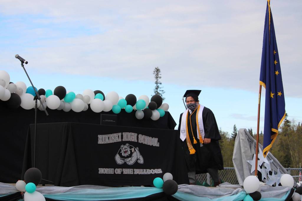 Senior Hamilton Hammie Cox walks onstage to receive his diploma during the 2020 Nikiski High School Graduation Commencement Ceremony in Nikiski, Alaska on May 19, 2020. (Photo by Brian Mazurek/Peninsula Clarion)