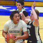 Soldotnas Ituau Tuisaula powers up against Nikiskis Kaycee Bostic on Tuesday, Jan. 21, 2020, at Soldotna High School in Soldotna, Alaska. (Photo by Jeff Helminiak/Peninsula Clarion)