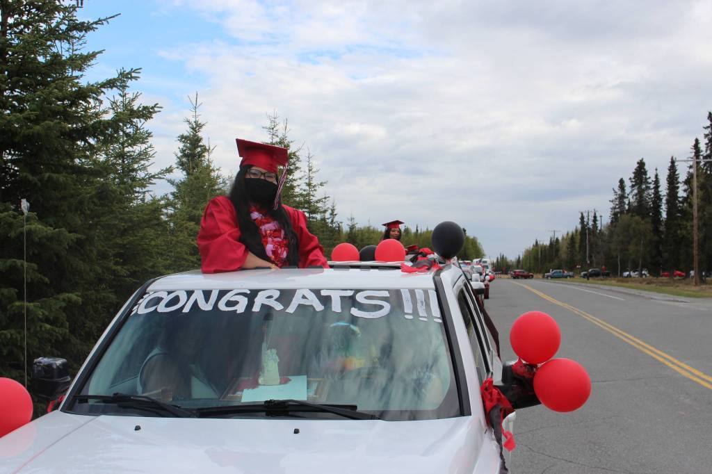 Class of 2020 graduate Rattanaporn Wangnoi, aka Ning, participates in Kenai Central High Schools Class of 2020 Graduation Parade in Kenai, Alaska, on May 20, 2020. (Photo by Brian Mazurek/Peninsula Clarion)