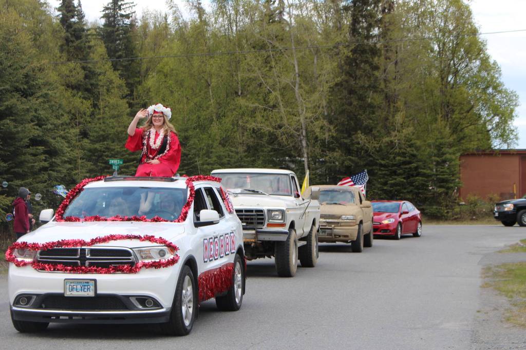 Senior Meghan Roney waves during the Kenai Central High Schools Class of 2020 Graduation Parade in Kenai, Alaska, on May 20, 2020. (Photo by Brian Mazurek/Peninsula Clarion)
