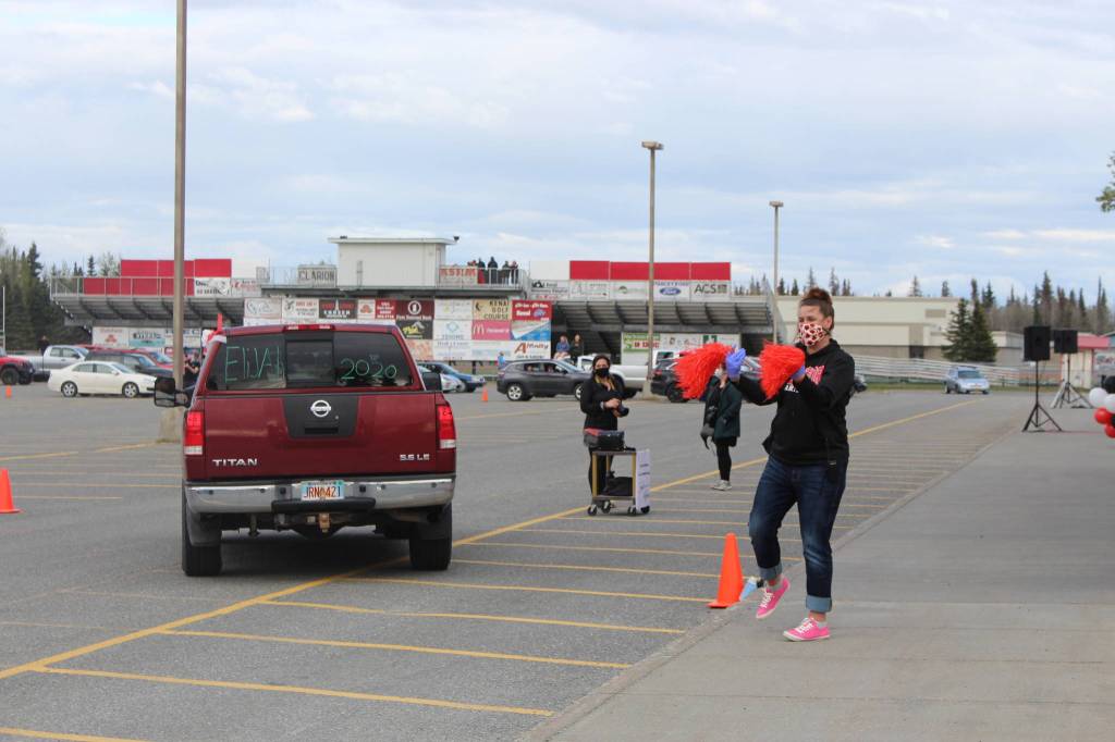 School counselor Laura Beeson directs traffic in style during Kenai Central High Schools Class of 2020 Graduation Parade in Kenai, Alaska, on May 20, 2020. (Photo by Brian Mazurek/Peninsula Clarion)