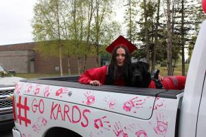 Senior Onaca Daniels and her dog Dez participate in Kenai Central High Schools Class of 2020 Graduation Parade in Kenai, Alaska, on May 20, 2020. (Photo by Brian Mazurek/Peninsula Clarion)
