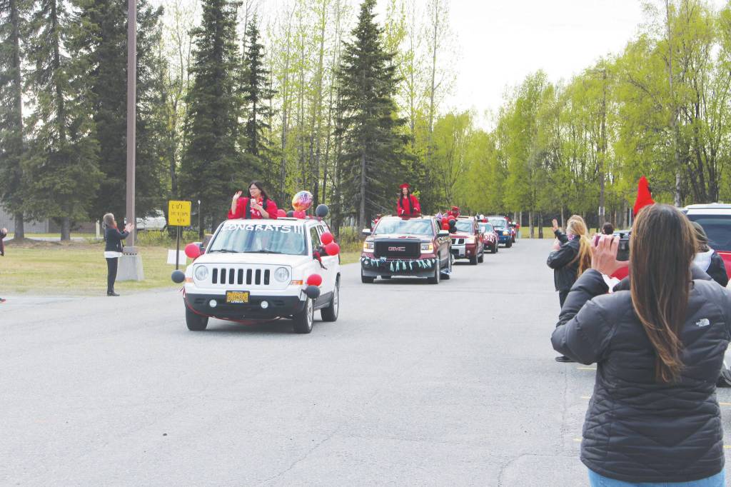 Seniors from the class of 2020 participate in the Kenai Central High Schools Class of 2020 Graduation Parade in Kenai, on Wednesday. (Photo by Brian Mazurek/Peninsula Clarion)