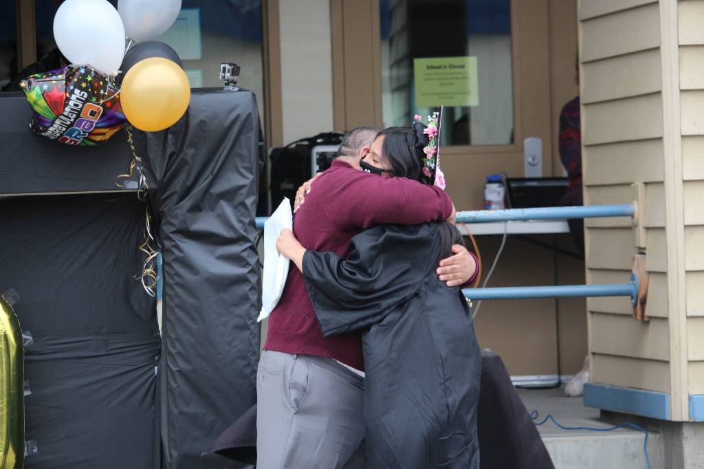 Estrella Slats hugs her dad, Don, after receiving her diploma during the Connections Homeschool Class of 2020 graduation.