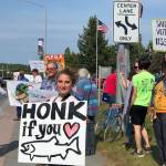 Residents line the Sterling Highway, in front of Sen. Lisa Murkowskis office to oppose Pebble mine on Wednesday, June 26, 2019, in Soldotna, Alaska. (Photo by Victoria Petersen | Peninsula Clarion File)