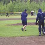Jeff Helminiak / peninsula clarion                                Alaska 20 head coach Robb Quelland hits infield practice Monday at the Soldotna baseball fields in Soldotna.
