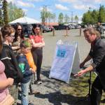 Magician Jungle Josh, right, performs for a small crowd of onlookers during the Wednesday Market at Soldotna Creek Park in Soldotna, Alaska on June 10, 2020. (Photo by Brian Mazurek/Peninsula Clarion)