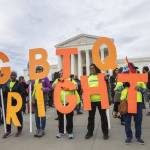 Manuel Balce Ceneta / associated press file                                 Supporters of LGBTQ+ rights hold placards in front of the U.S. Supreme Court in Washington on Oct. 8, 2019.