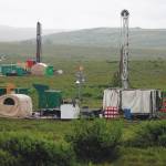 In this July 13, 2007, file photo, workers with the Pebble Mine project test drill in the Bristol Bay region of Alaska, near the village of Iliamma. The Pebble Limited Partnership, which wants to build a copper and gold mine near the headwaters of a major U.S. salmon fishery in southwest Alaska, says it plans to offer residents in the region a dividend. (AP Photo/Al Grillo, File)