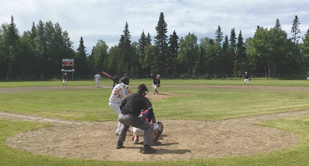 (Photo by Jeff Helminiak/Peninsula Clarion)                                Alaska 20 starting pitcher Mose Hayes delivers a pitch to Services Jake Rafferty on Tuesday at the Kenai Little League Fields in Kenai.