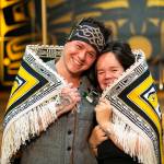 Ricky Tagaban and Lily Hope display the robe they collaborated to weave at its First Dance ceremony.