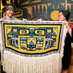 Lily Hope and Ricky Tagaban display the robe they collaborated to weave at its First Dance ceremony at the Sealaska Heritage Institute on Monday, June 22, 2020. (Courtesy photo | Annie Bartholomew)