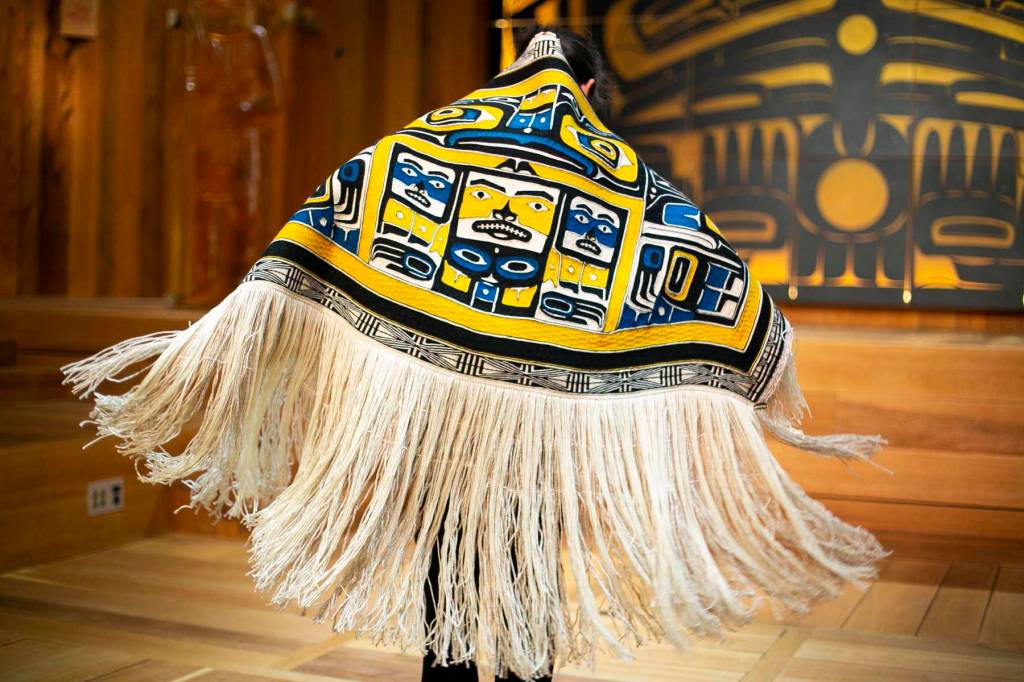 Courtesy photo | Annie Bartholomew                                Lily Hope and Ricky Tagaban, two of Juneaus preeminent Chilkat and Ravenstail-style weavers, celebrated the completion of a robe Monday in Juneau. The first dance honors the journey of the weavers and blanket. See Arts on Page A10
