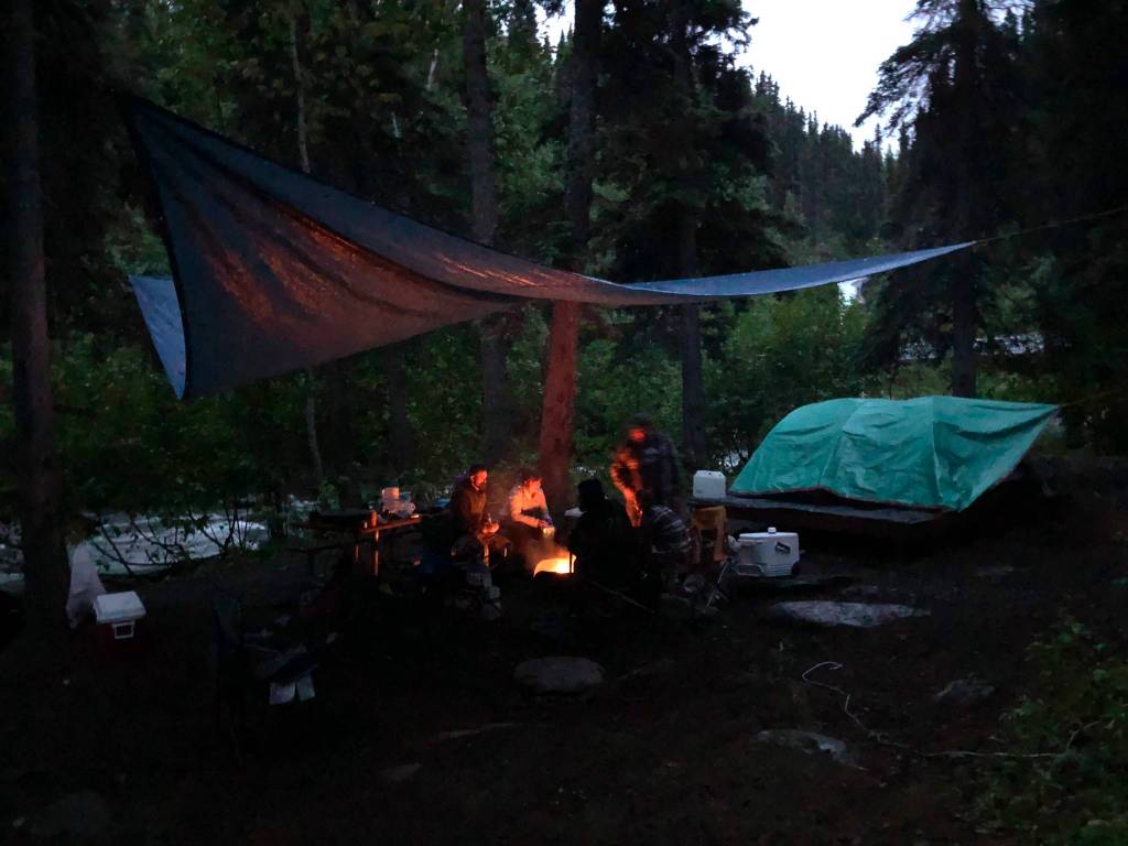 Campers cook and eat on a fire pit, June 19, in the Copper River Valley. (Photo by Victoria Petersen/Peninsula Clarion)