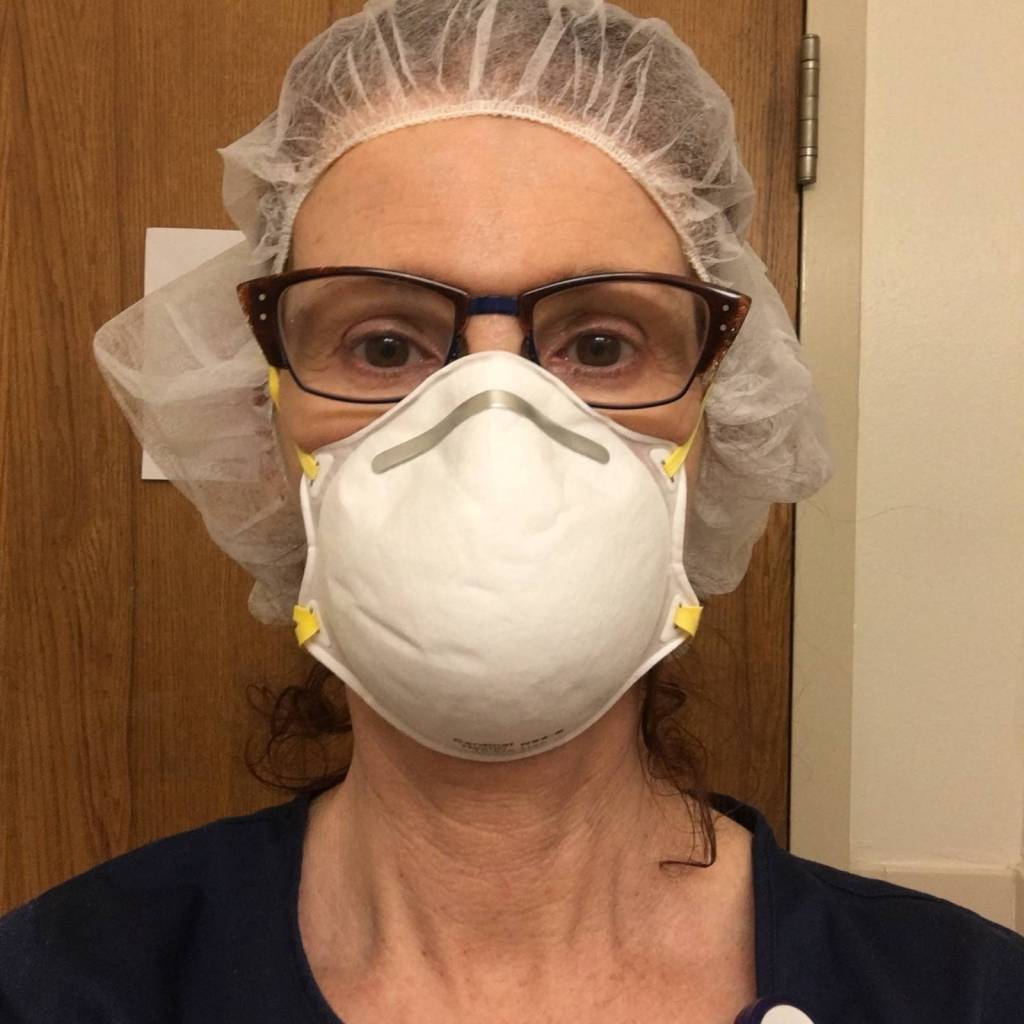 Robin Richardson, an RN at Central Peninsula Hospital in Soldotna, gets ready to don her personal protective equipment during a shift at White Plains Hospital in White Plains, New York on May 3, 2020. (Photo courtesy Robin Richardson)