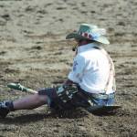 Rodeo announcer James Hastings is pulled behind a horse during the shovel race at the annual Ninilchik Rodeo on Saturday, July 4, 2020 at the Kenai Peninsula Fairgrounds in Ninilchik, Alaska.
