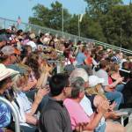 Members of the crowd at this years Ninilchik Rodeo cheer during an event Saturday, July 4, 2020 at the Kenai Peninsula Fairgrounds in Ninilchik, Alaska. The rodeo celebrated 60 years with a rooted in hisotry theme. (Photo by Megan Pacer/Homer News)