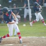 Alaska 20s Davey Belger fouls off a pitch against Eagle River while Harrison Metz times up the pitcher in the on-deck circle Tuesday, July 7, 2020, at the Kenai Little League fields in Kenai, Alaska. (Photo by Jeff Helminiak/Peninsula Clarion)