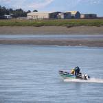 Fishermen head upstream on the Kenai River during the first day of dipnetting on July 10, 2020. (Photo by Brian Mazurek/Peninsula Clarion)