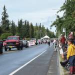 Brian Mazurek/Peninsula Clarion                                 Onlookers await the passing of parade floats at the Progress Days Parade in Soldotna on July 27, 2019.