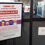 A sign detailing the stores mask policy is seen here outside Safeway in Soldotna on July 21, 2020. (Photo by Brian Mazurek/Peninsula Clarion)