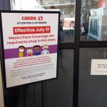A sign detailing the stores mask policy is seen here outside Safeway in Soldotna on July 21, 2020. (Photo by Brian Mazurek/Peninsula Clarion)