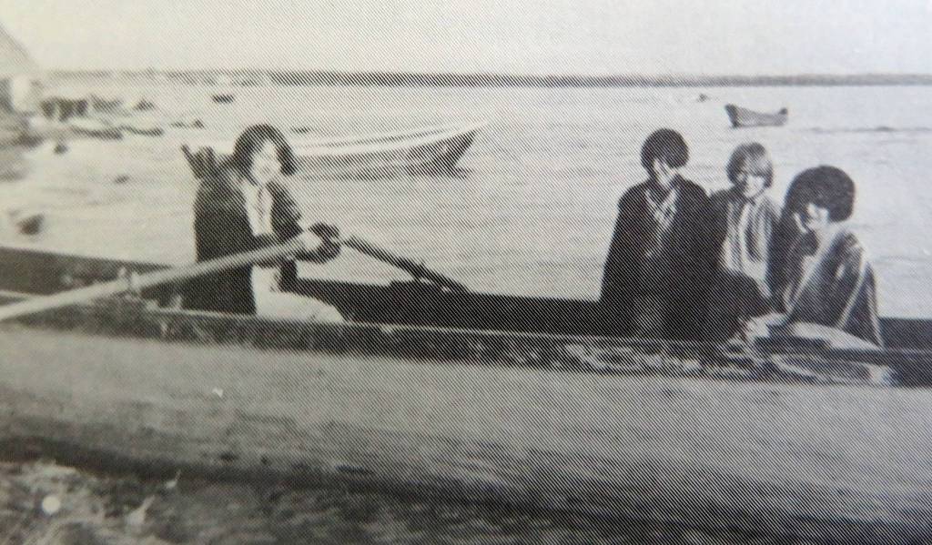 Beverly Sabrowski (with oars) in a boat at the mouth of the Kenai River in September 1929. Her passengers are (from left): Marie Hermansen, Susie March and Sabrowskis mother, Gertrude Cox. (Beverly Christensen photo from Once Upon the Kenai)