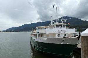 The Wilderness Adventurer is shown Wednesday, Aug. 5, 2020, following its return to Juneau, Alaska, after one of its 36 passengers tested positive for COVID-19. The first cruise of the stunted season was cut short, and all passengers were required to quarantine at a hotel while the 30 crew members were to quarantine on the ship. (AP Photo/Becky Bohrer)