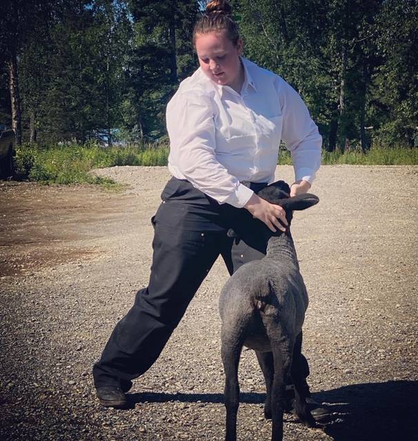 Ella Rankin with the North Road Rangers shows off her goat that will be sold at the 2020 Kenai Peninsula 4-H Junior Market Livestock Auction in this undated photo. (Photo courtesy Cassy Rankin)
