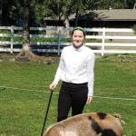 Kellee Martin with the North Road Rangers shows off her pig that will be sold at the 2020 Kenai Peninsula 4-H Junior Market Livestock Auction in this undated photo. (Photo courtesy Cassy Rankin)
