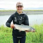 Reece Tousignant, 15, of Green Bay, Wisconsin, poses with a pink salmon he caught on Monday, Aug. 3, 2020, at the Nick Dudiak Fishing Lagoon in Homer, Alsaka. (Photo by Michael Armstrong/Homer News)
