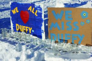 Painted signs posted at the candlelight vigil held for Anesha Duffy Murnane on Saturday, Feb. 1, 2020, at WKFL Park in Homer, Alaska, affirm love for Murnane and beseech her safe return. (Photo by Delcenia Cosman)