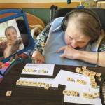 Resident Pattie Tincher and her daughter, April, use a tablet to connect recently at Heritage Place in Soldotna, Alaska. (Photo provided by Aud Walaszek/Heritage Place)