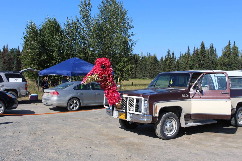 The family of 4-H member Addy Pederson decorated their truck in honor of Pedersons Blue Ribbon turkey, which was this years Community Service Animal. The money from the sale of Pedersons turkey went to Haven House in Homer, which provides services to victims of domestic violence and sexual assault. The truck is seen here during the 4-H Junior Market Drive-in Auction at the Soldotna Rodeo Grounds on Aug. 15, 2020. (Photo by Brian Mazurek/Peninsula Clarion)