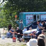 Allen Auxier places a bid on behalf of the Soldotna Rotary during the 4-H Junior Market Drive-in Auction at the Soldotna Rodeo Grounds on Aug. 15, 2020. (Photo by Brian Mazurek/Peninsula Clarion)