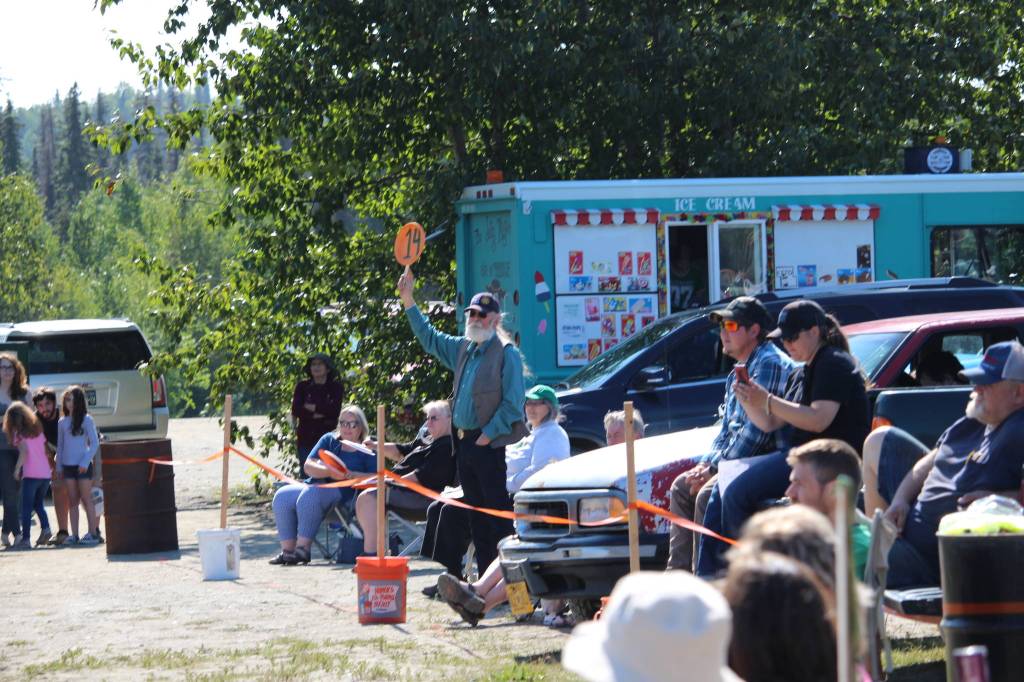 Allen Auxier places a bid on behalf of the Soldotna Rotary during the 4-H Junior Market Drive-in Auction at the Soldotna Rodeo Grounds on Aug. 15, 2020. (Photo by Brian Mazurek/Peninsula Clarion)
