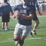 Soldotna quarterback Brock Wilson prepares to pass at the football jamboree Saturday at Ed Hollier Field at Kenai Central High School in Kenai, Alaska. (Photo by Jeff Helminiak/Peninsula Clarion)