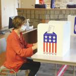 Brian Mazurek / Peninsula Clarion                                Kim Lofstedt casts her vote early in Alaskas Primary Election at Kenai City Hall on Monday.