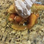 A generous dollop of whipped cream tops off peach cobbler, as seen here on Aug. 1, 2020, in Teri Robls Homer, Alaska, kitchen. (Photo by Teri Robl)