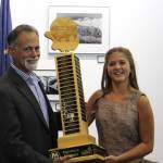 Sen. Peter Micciche, R - Soldotna, hands off the 1st place Caring for the Kenai trophy to Anna DeVolld at the Kenai Visitor Center on Aug. 19, 2020. (Photo by Brian Mazurek/Peninsula Clarion)
