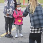 Jeff Helminiak / Peninsula Clarion                                Mollie Kirk and her daughter, Peyton, pose for a photo Monday for kindergarten teacher Cynthia Fudzinski at Mountain View Elementary School in Kenai.