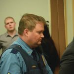 Former Alaska State Trooper Sgt. Jeremy Stone leads a defendant out of a courtroom at the Homer Courthouse at the conclusion of a sentencing hearing on March 12, 2015, in Homer, Alaska. (Photo by Michael Armstrong/Homer News)