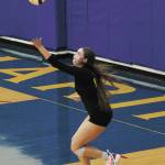Sewards Sequoia Sieverts serves the ball to Homer while wearing a mask during a Friday, Aug. 21, 2020 volleyball game between the two varsity teams at Homer High School in Homer, Alaska. A Homer-hosted jamboree scheduled for Saturday was changed to a matchup between the teams from Homer and Seward after sports were canceled for all central peninsula schools last week. The region moved into the high risk category in terms of community transmission of COVID-19. (Photo by Megan Pacer/Homer News)