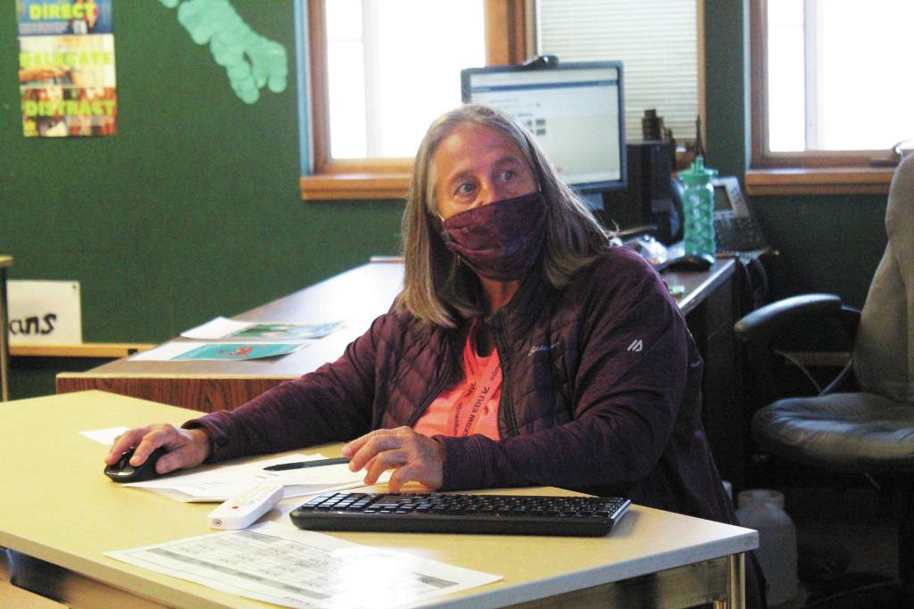 Linda Rourke navigates the various web pages needed for her Alaska History class, where she is a longterm sub, on Monday, Aug. 24, 2020 at Homer High School in Homer, Alaska. (Photo by Megan Pacer/Homer News)