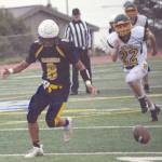 Mariners player Sly Ganoa goes for a fumble in a game at Homer, Alaska, on Aug. 29, 2020. (Photo by Michael Armstrong/Homer News)